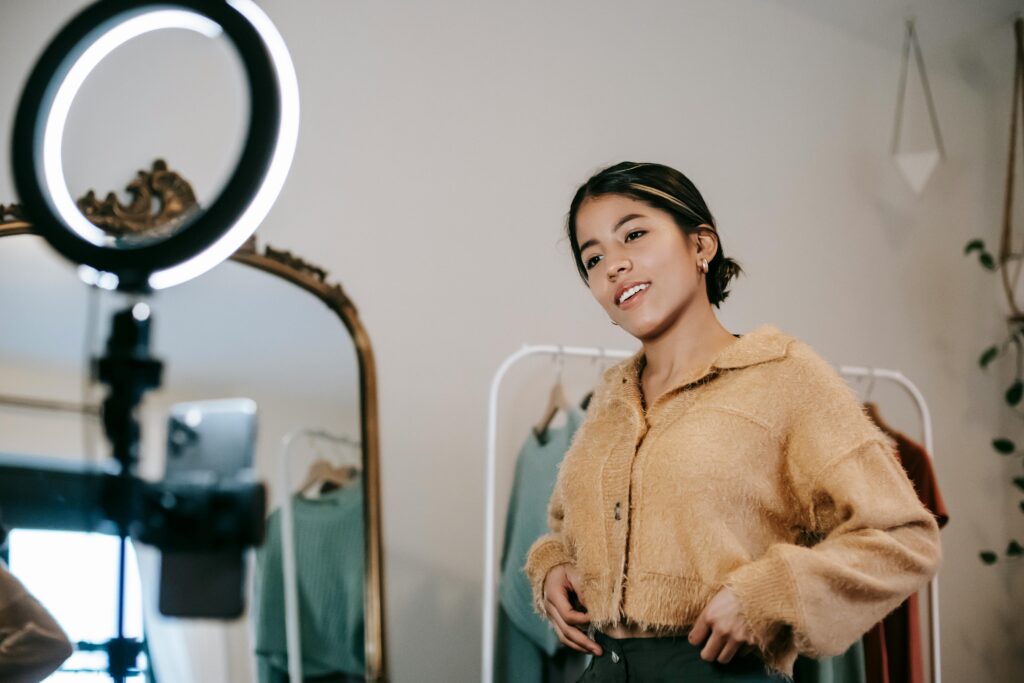 Women recording video on phone with ring light