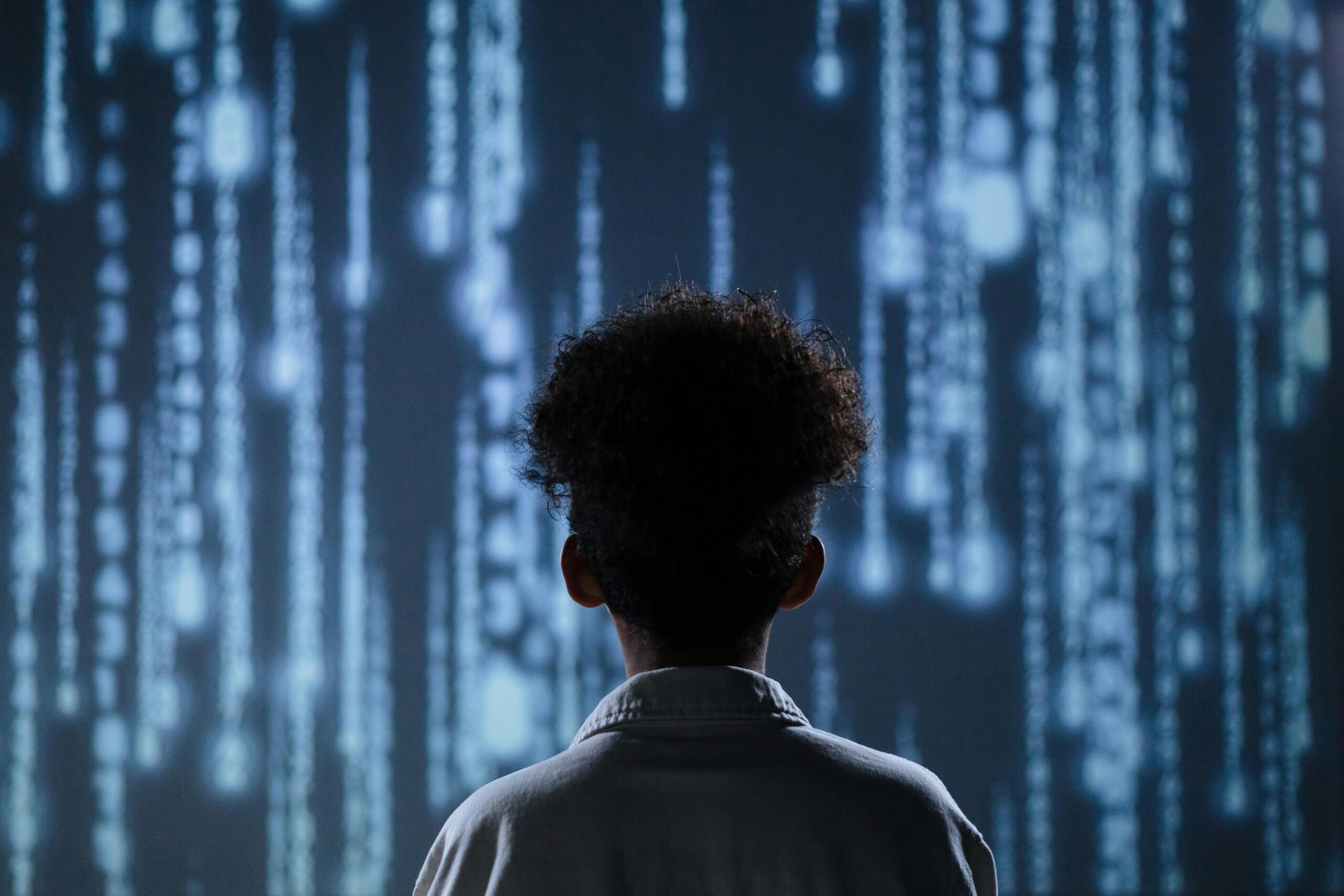 Person staring at data stream to represent confusion and awe about digital marketing search strategies.